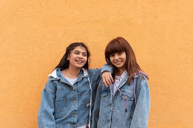 Two happy smiling girls love and friendship positive emotions