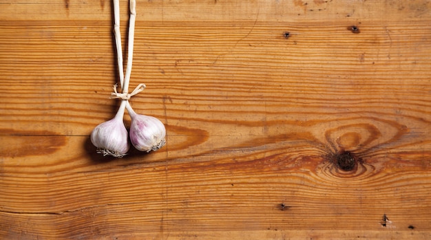 The two heads of garlic on a cutting board