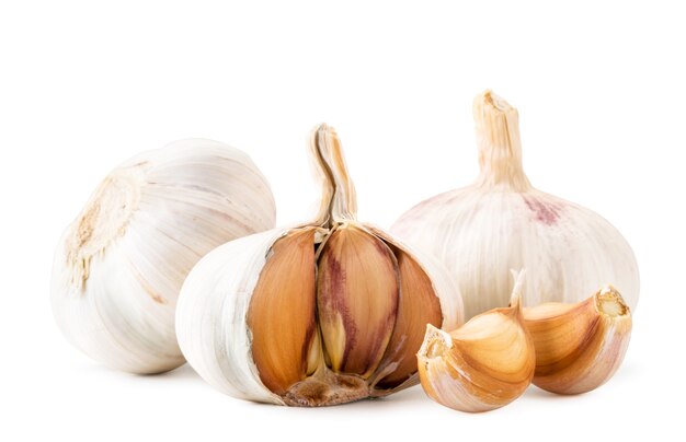 Two heads of garlic, half and slices close-up  Isolated.