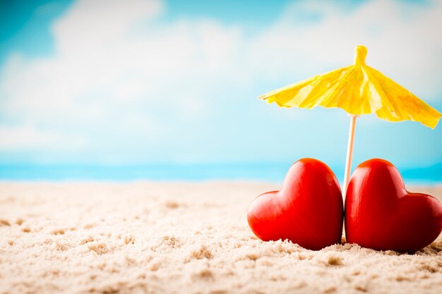 Two hearts on the beach. Honeymoon on summer