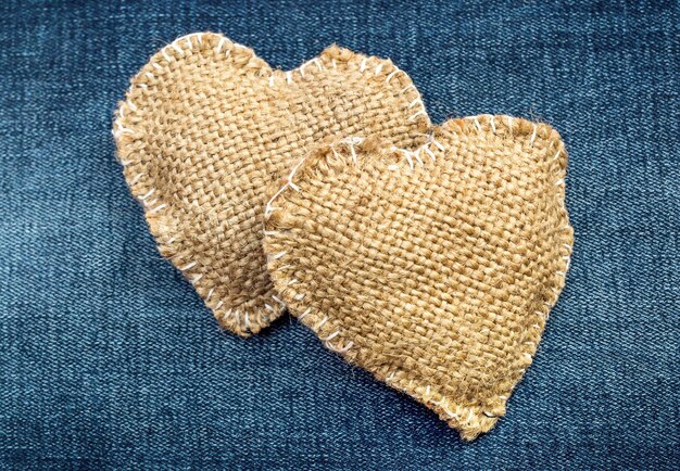 Photo two hearts on the jeans texture top view