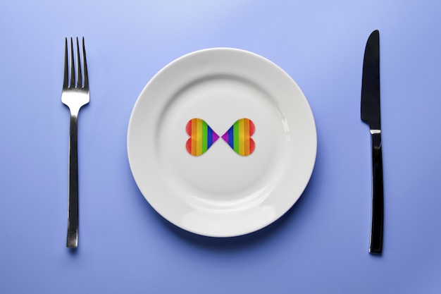 Two hearts in LGBT flag colors in plate