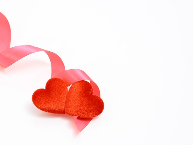 two hearts and red ribbon