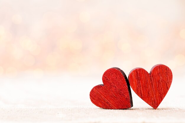 Two Hearts. Valentines day greeting card with bokeh background.