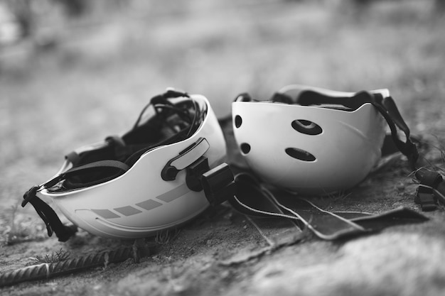 Two helmets on the head of climbers on the ground