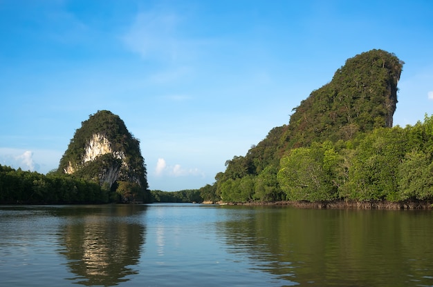Two high rocks are the main attraction of Krabi Thailand. river between two high cliffs.