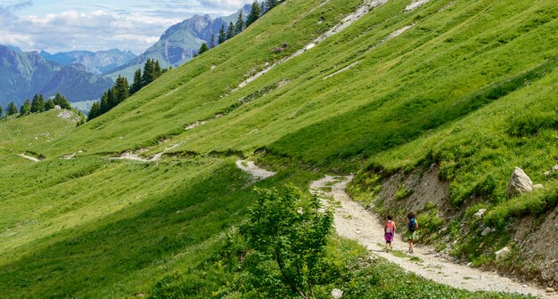 Two hikers walking in the mountains