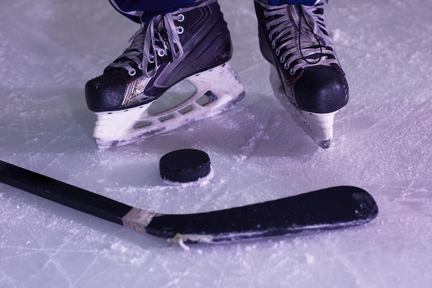 two hockey sticsk and puck on ice, start of the game, competition concept in business, top view