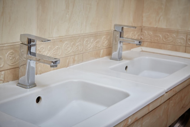 Two home bathroom sinks for washing hands