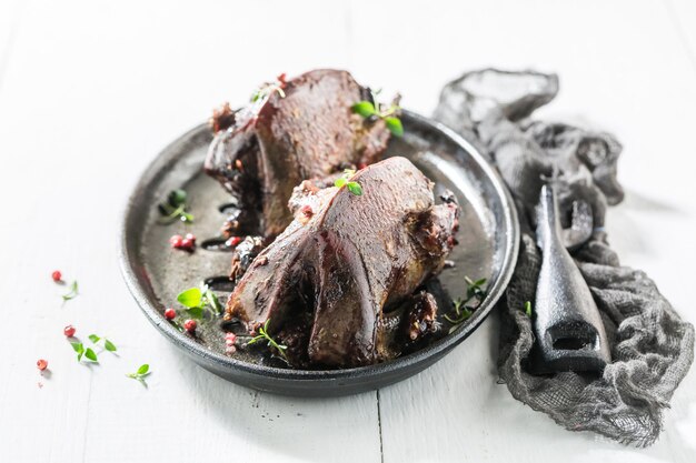 Two homemade pigeons with pepper and spices