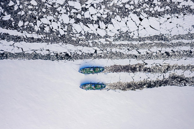 Two icebreakers on river crush the ice in Poland