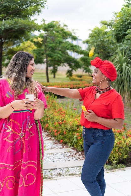 Two indigenous women talking in the city park