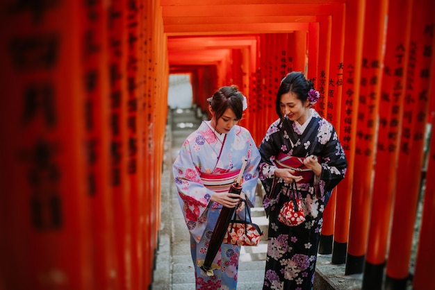 Two japanese girls wearing kimonos traditional clothes, lifestyle moments