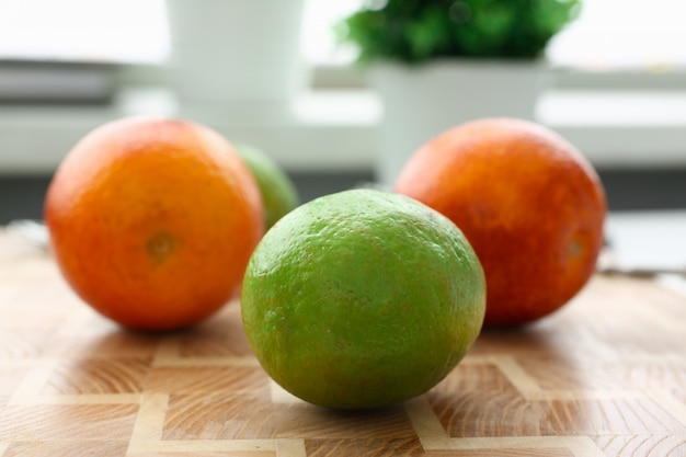 Two juicy oranges standing on the table