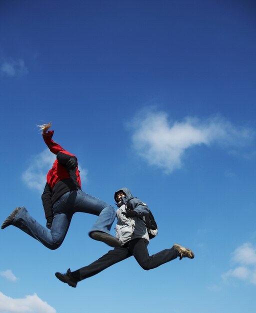 Photo two jumping teens