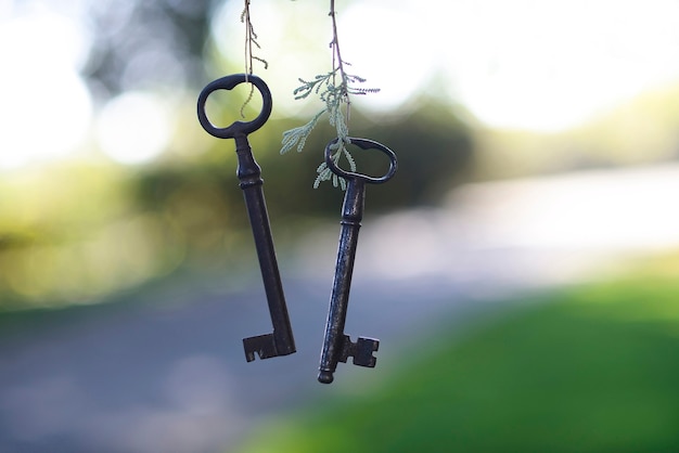 Two keys of ancient country house on natural background