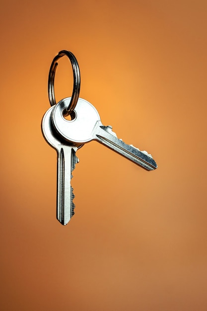 Two keys Door keys on brown background