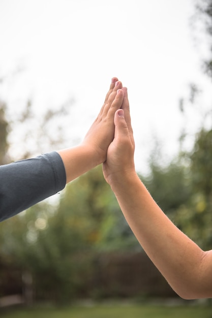 Two kid boys  giving high five.