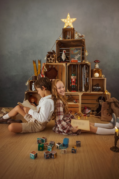 Two Kids Playing at Home during Winter Holidays