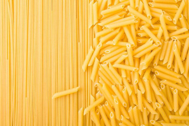 Two kinds of uncooked pasta background