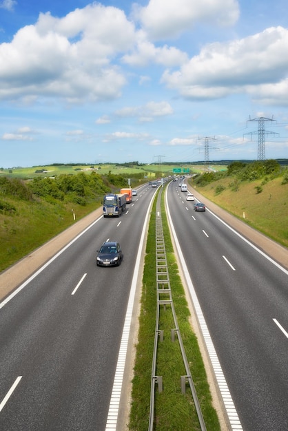 Premium Photo | Two lane traffic traffic on a two lane highway in denmark