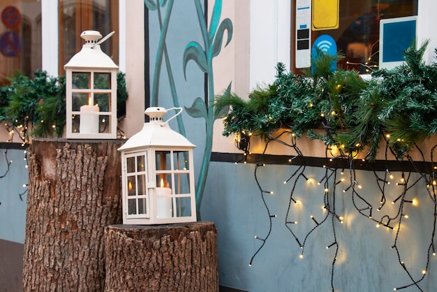 Two lanterns for christmas at the entrance to the store new\
year\'s decor