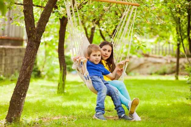 Two little friends spend time together in the backyard