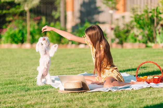 Two little kids on picnic in the park