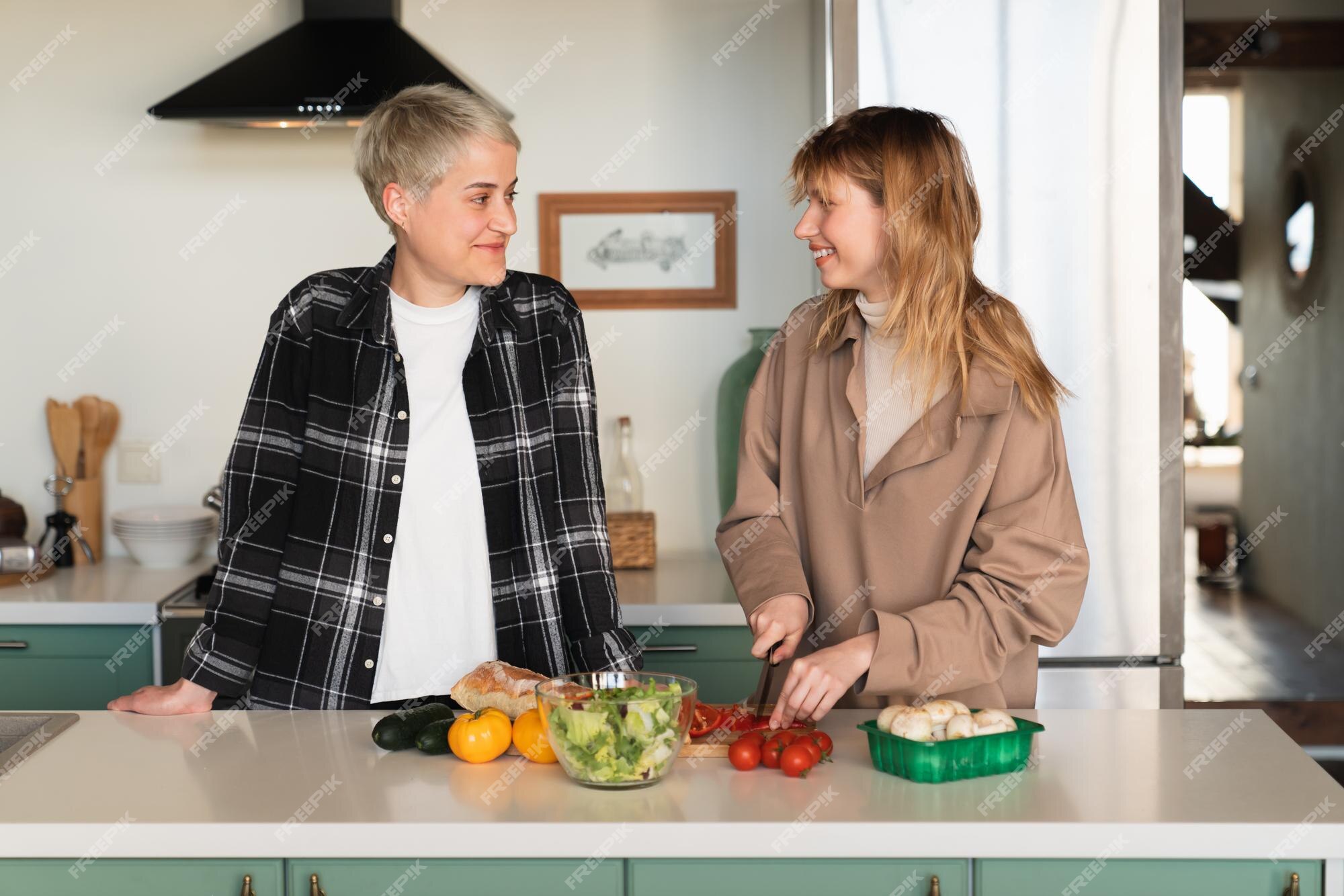 Premium Photo Two Loving Girlfriends Cooking Preparing Food Breakfast