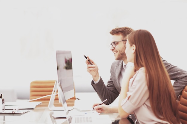 Two managers in a business meeting analyzing data