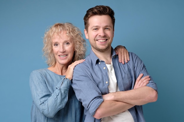 Two mature man and woman looking confident at camera