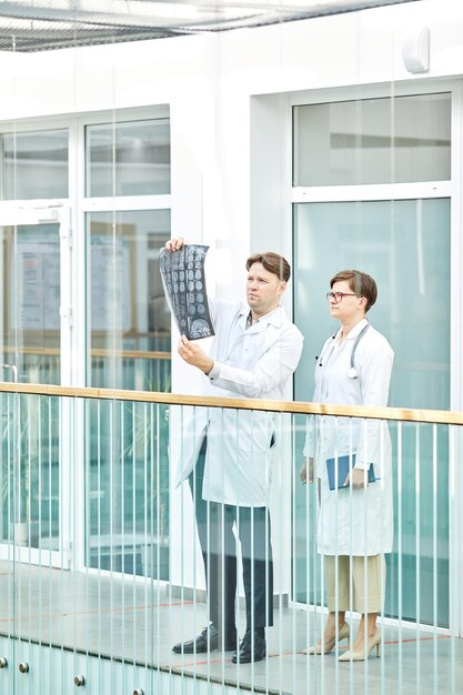 Two Medics Inspecting X Ray Images