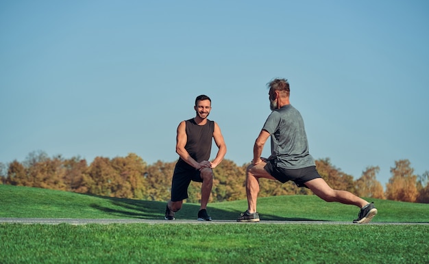 The two men doing exercise outdoor