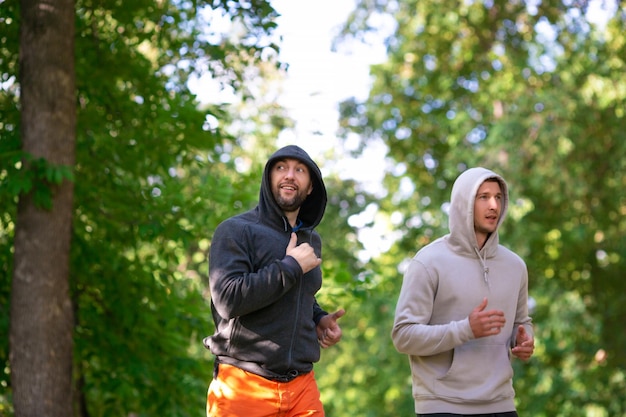 Two men jogging outdoor selective focus