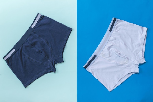 Two men's underpants on a light and dark blue background