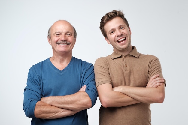 Two men and son laughing having a good mood