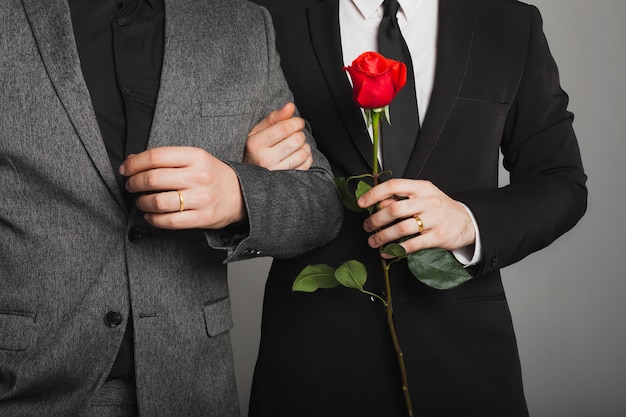 Two men in a suit at an LGBT wedding