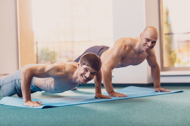 Two men will perform fitness training in the gym