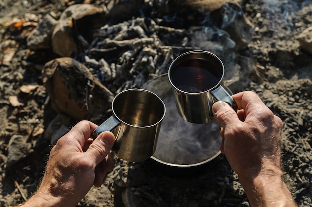 Two metal mugs.