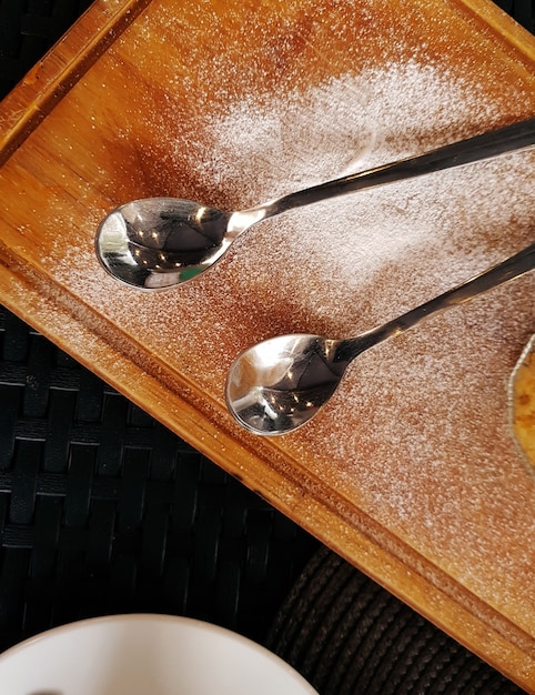 Two metal spoons on the table. top view