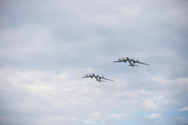 Two military long range bomber aircrafts flying in the sky