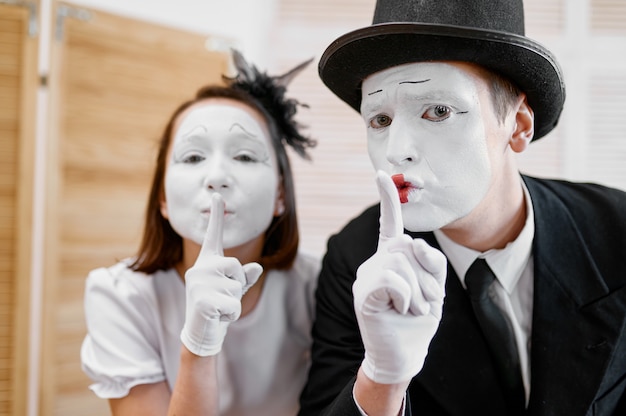 Two mime artists, secret gesture, parody