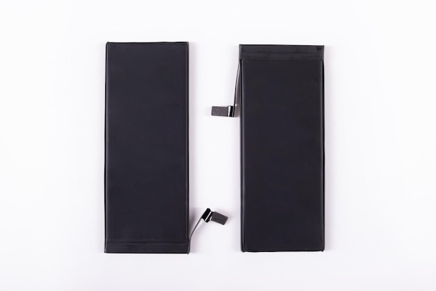 Two mobile phone batteries on a white background