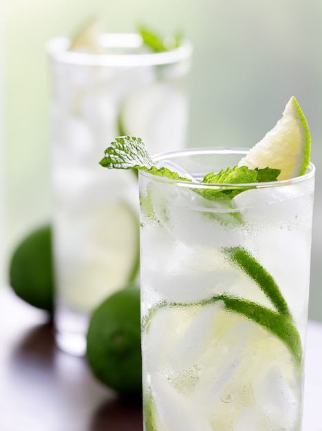 Two mojitos closeup on wooden table top