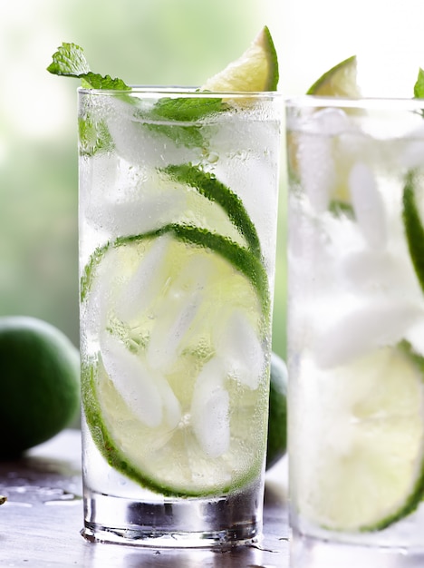 Two mojitos closeup on wooden table top