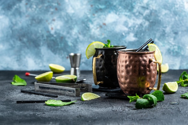 Two moscow mules cocktail with ginger beer vodka lime Long banner format top view