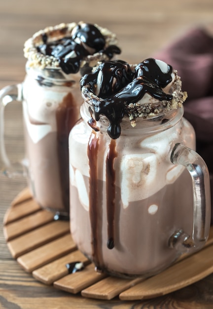 Two mugs of hot chocolate with marshmallows