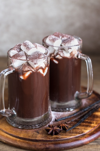 Two mugs of hot chocolate with marshmallows