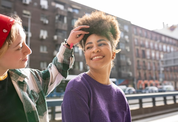 Two multiracial women look at each other