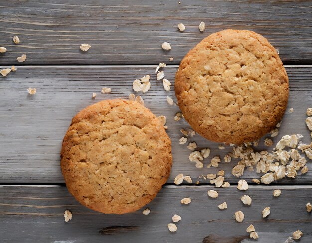 Two oatmeal cookies top view with copy space